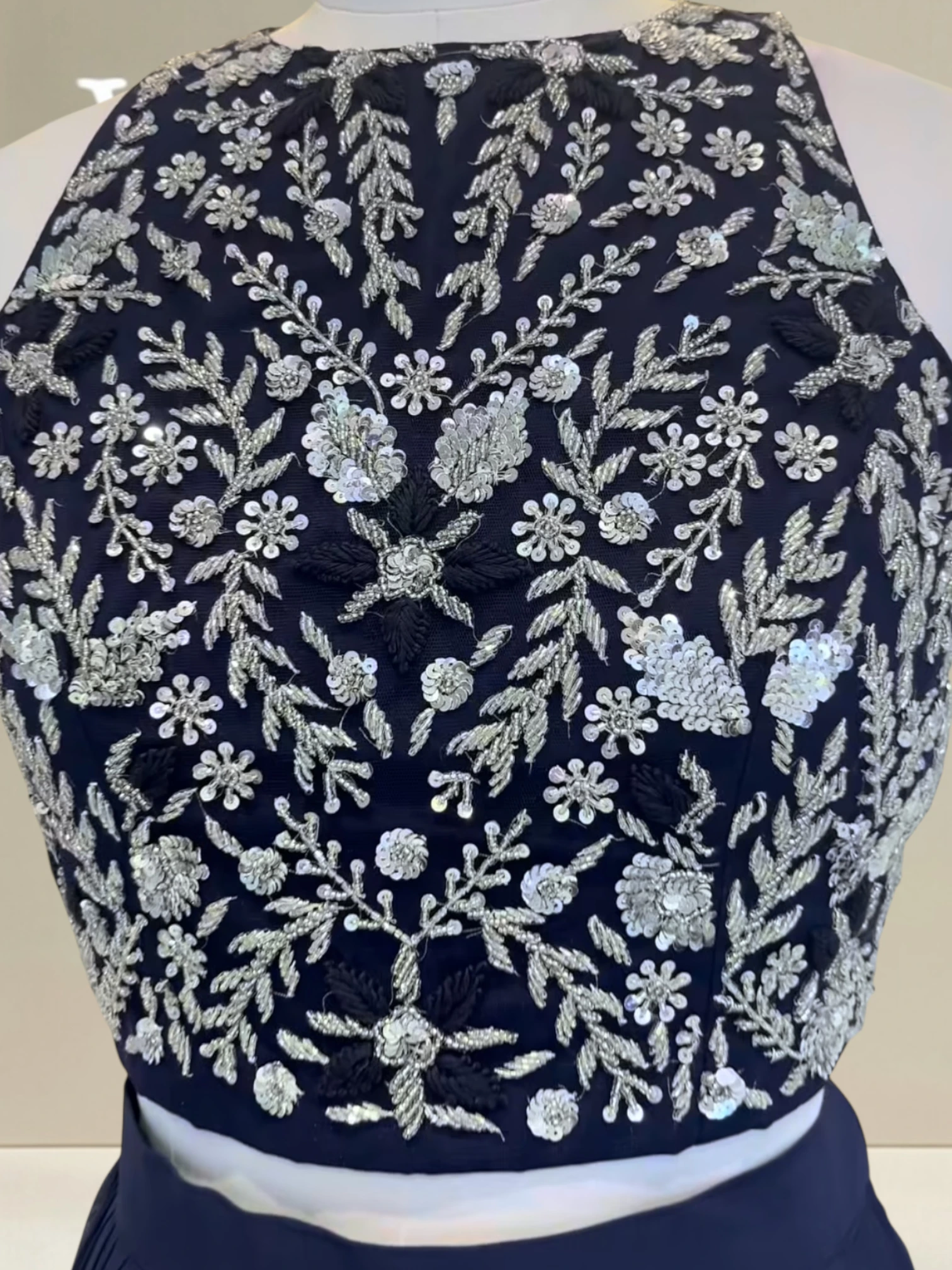 Plated skirt paired with stylish cape0 product image